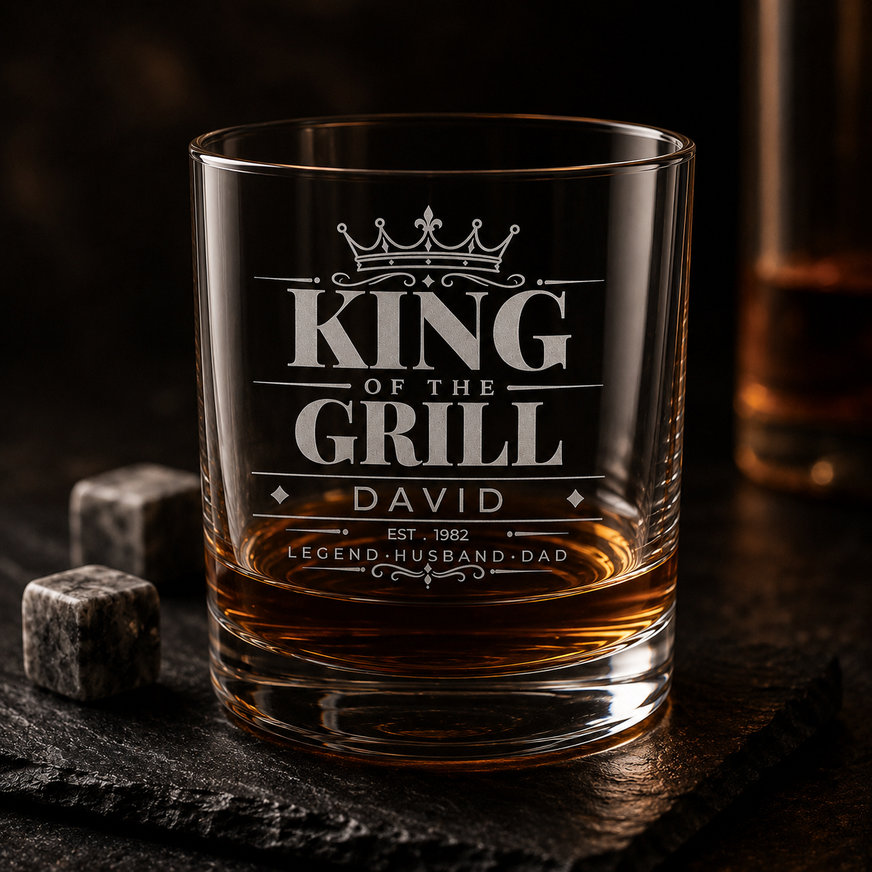 Personalised King of the Grill engraved glass with amber drink and stone cubes