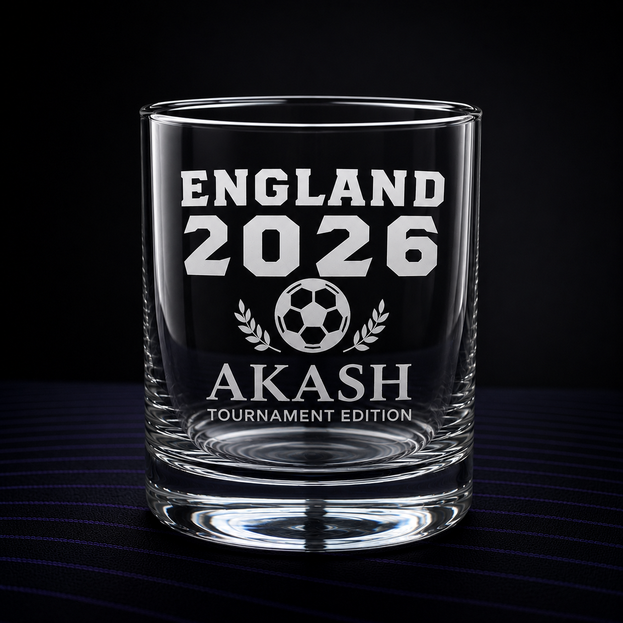 Personalised engraved whisky glass on dark background